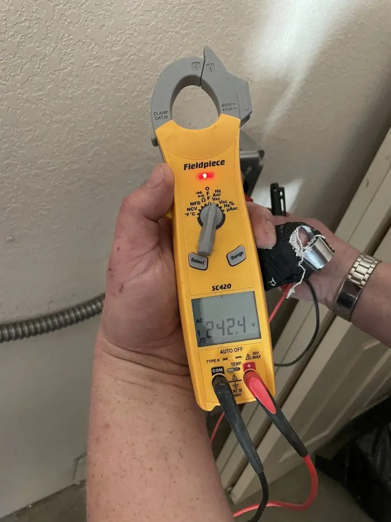 Voltage testing with clamp meter during Electrical Installation Services in Winchester
